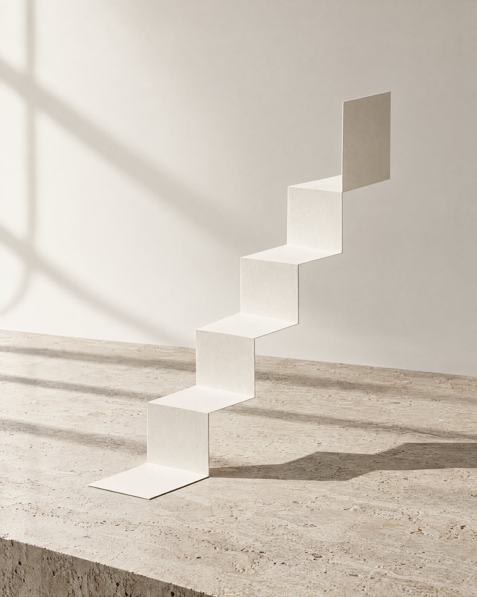 A strip of white paper folded into a rising stair